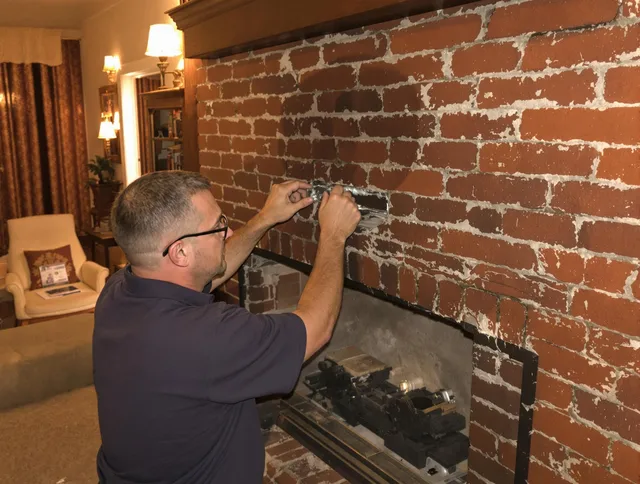 Solon Chimney Sweep expert fixing a fireplace in Solon, OH